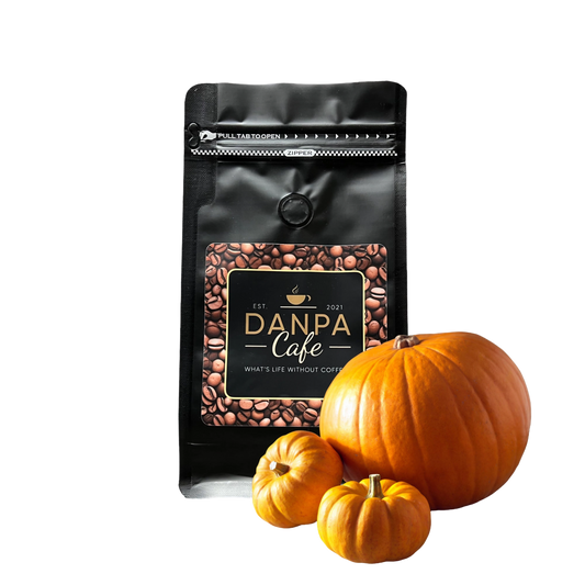Aromatic pumpkin spice coffee beans arranged with small pumpkins